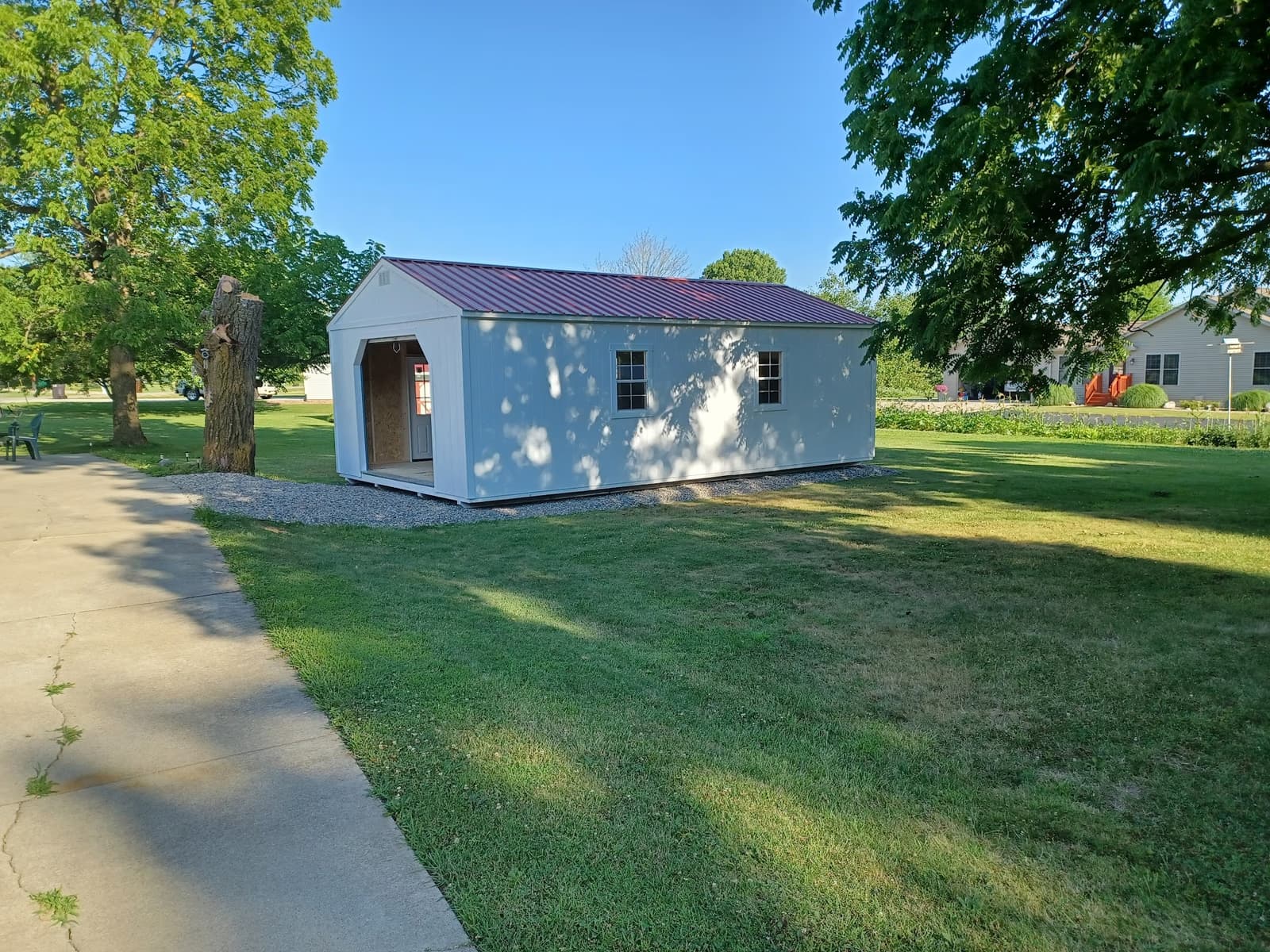 Customer garage on a Michigan property with landscaped yard