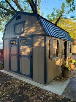 Amish-built lofted garden shed with LP SmartSide siding at a customer property in Southern Michigan