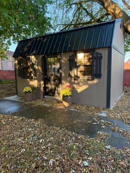 Amish-built lofted garden shed with LP SmartSide siding at a customer property in Southern Michigan