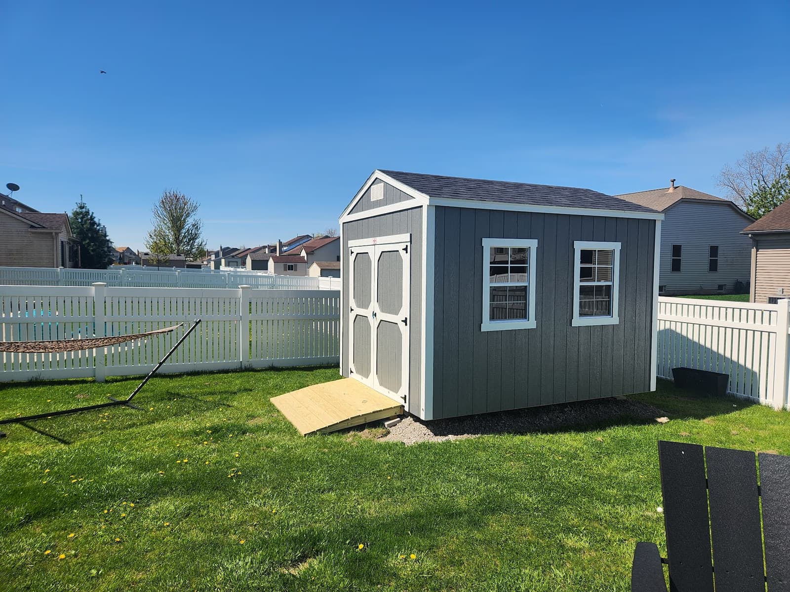 Customer utility shed on a gravel pad