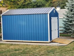 Amish-built utility shed with metal siding at a customer property in Southern Michigan