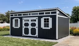 Amish-built studio shed with LP SmartSide siding at a customer property in Southern Michigan
