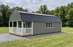 Amish-built lofted cabin with metal siding, representative display photo