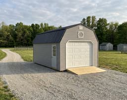 Amish-built lofted garage with vinyl siding, representative display photo