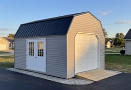 Amish-built lofted garage with vinyl siding, representative display photo