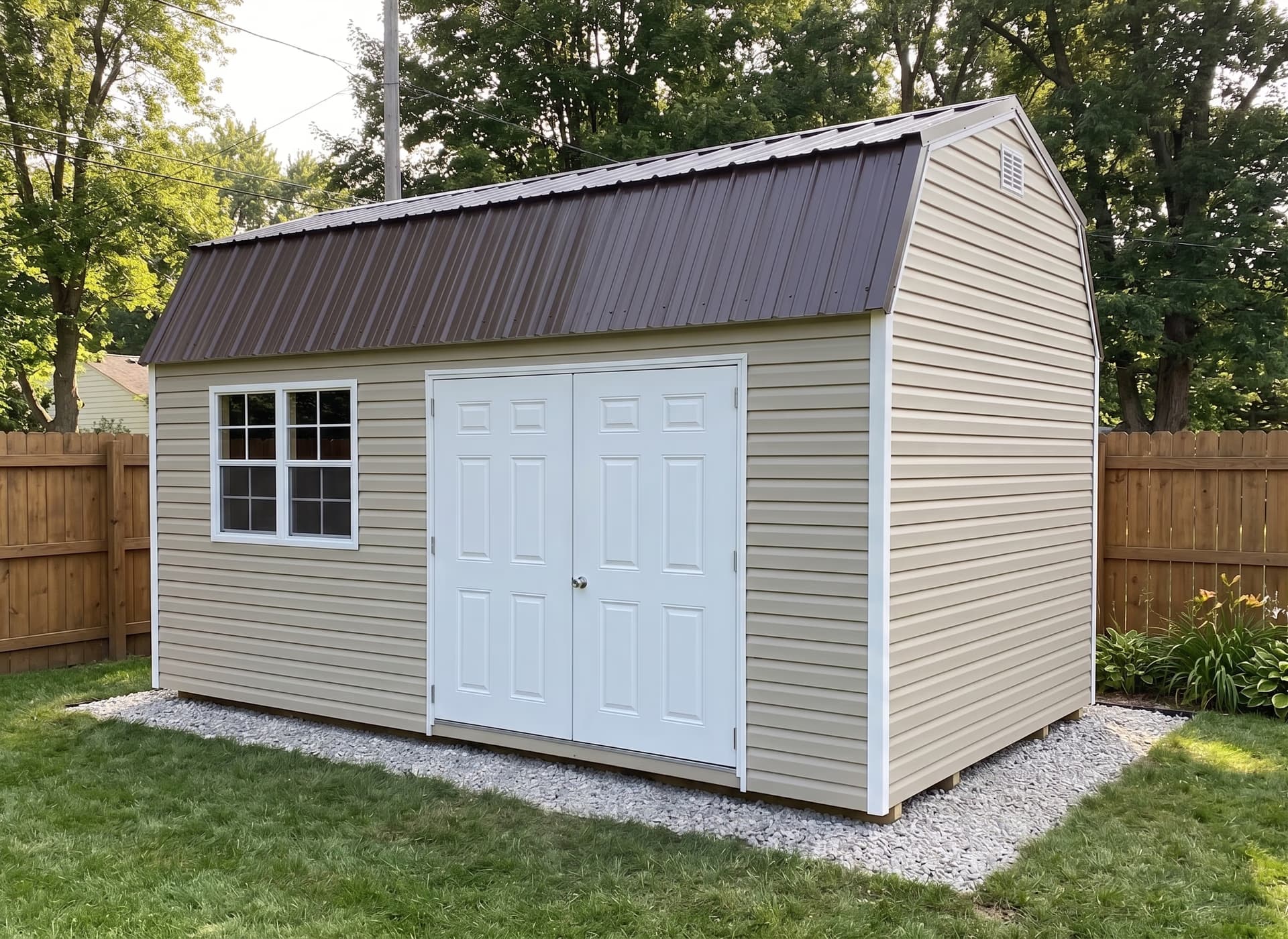 Amish-built lofted garden shed in vinyl siding on a Michigan property