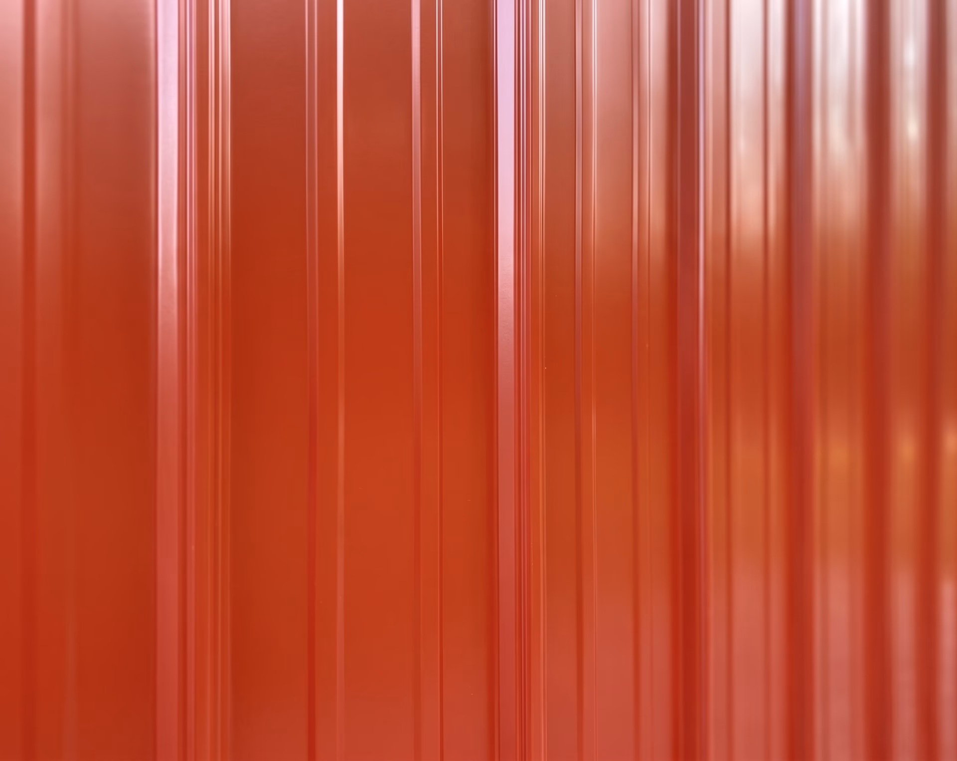 Painted vertical metal siding close-up