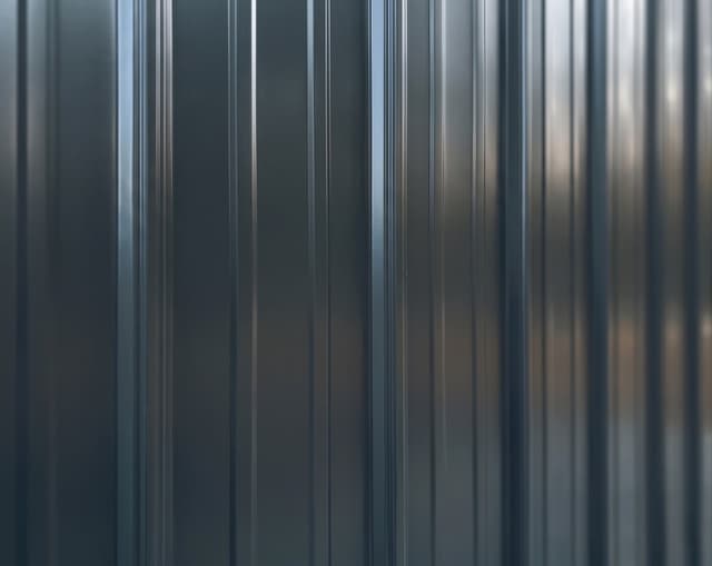 Painted vertical metal siding close-up