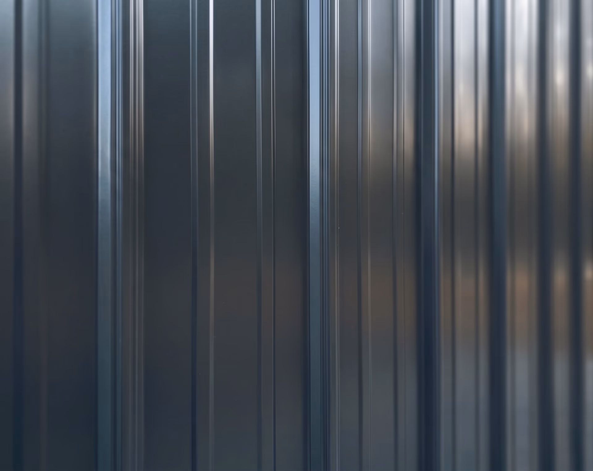 Painted vertical metal siding close-up