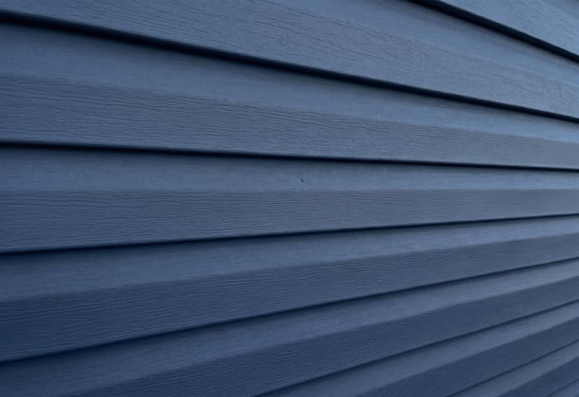 Navy horizontal vinyl lap siding close-up