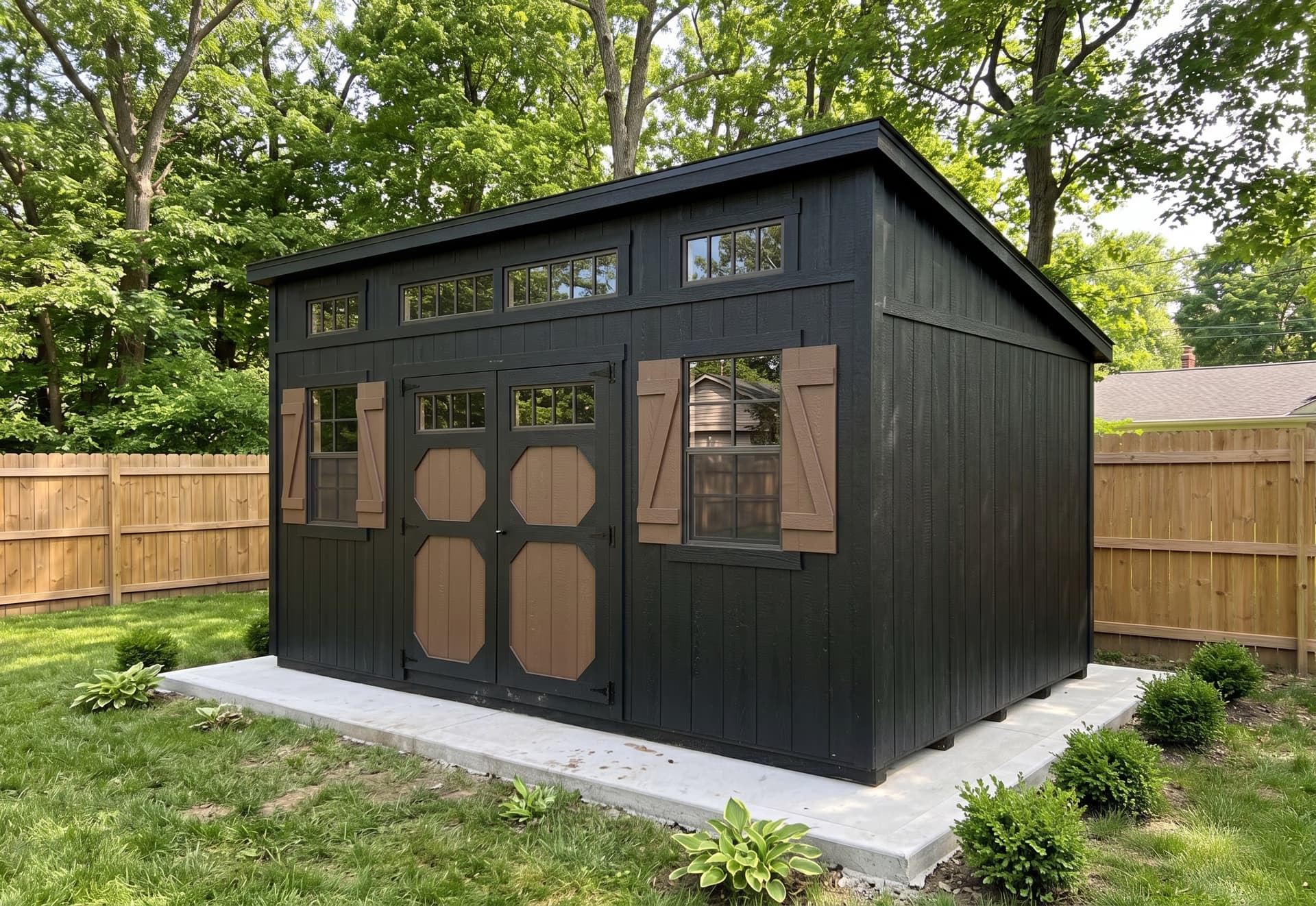 Amish-built black studio shed on a Michigan property
